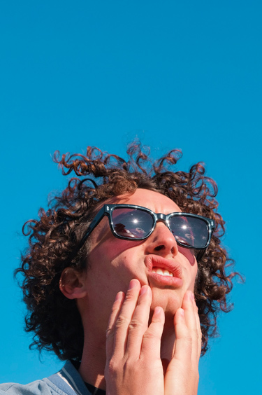 A man wearing a pair of Arman Sunglasses from Nerdy Frames